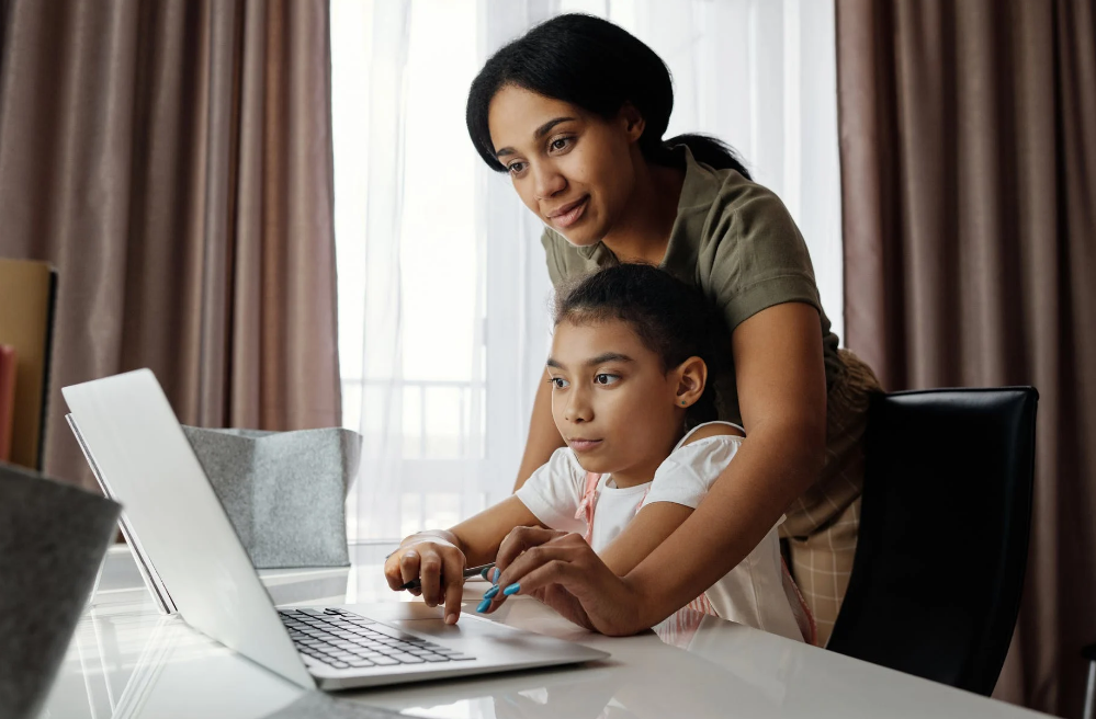 A mother is helping her daughter attend live elementary school