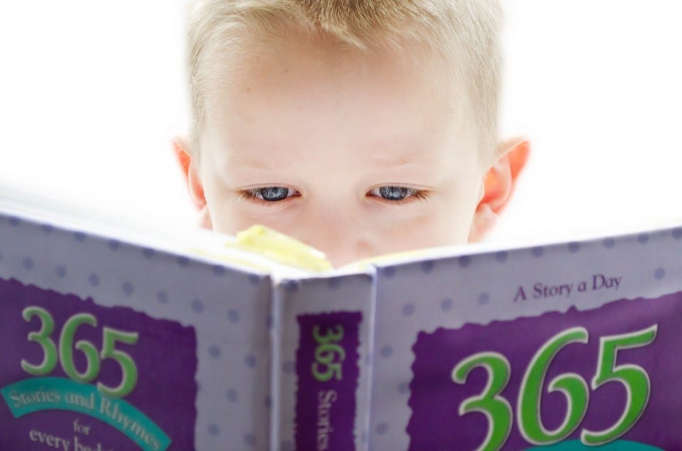 A young boy reading a book
