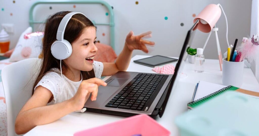 girl actively participating in online class