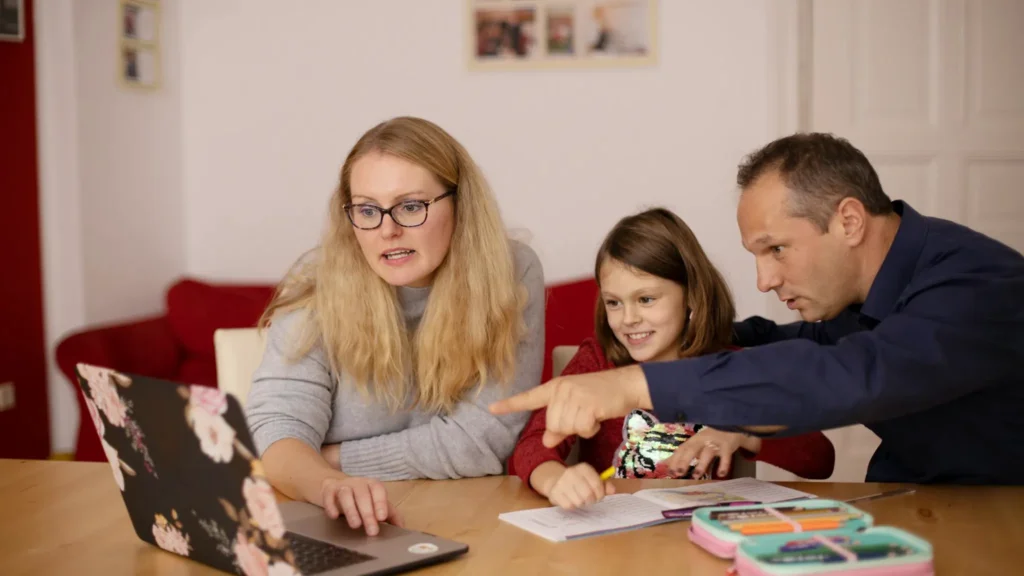 Young student engaged in an online learning session on a laptop at home