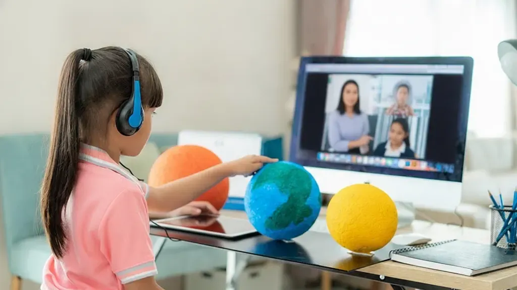 Student participating in a live online class from home